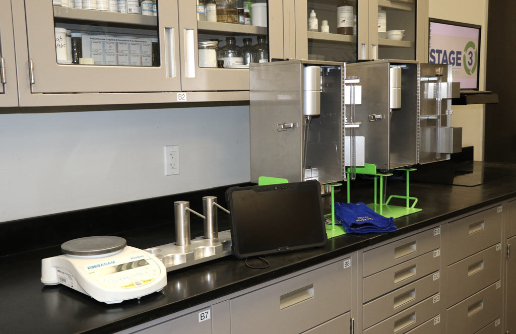 A Stage 3 laboratory setting with equipment on lab counters.  