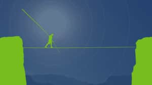 A silhouette of a person walking on a tightrope between two green cliffs under a blue sky.